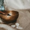 brown wooden bowl on white textile